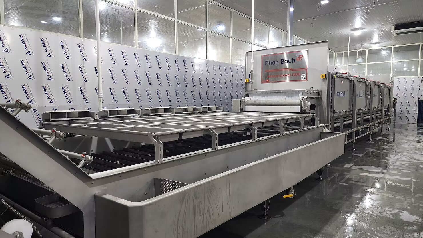Steam Cooker during installation and fine-tuning at a shrimp processing plant in India.